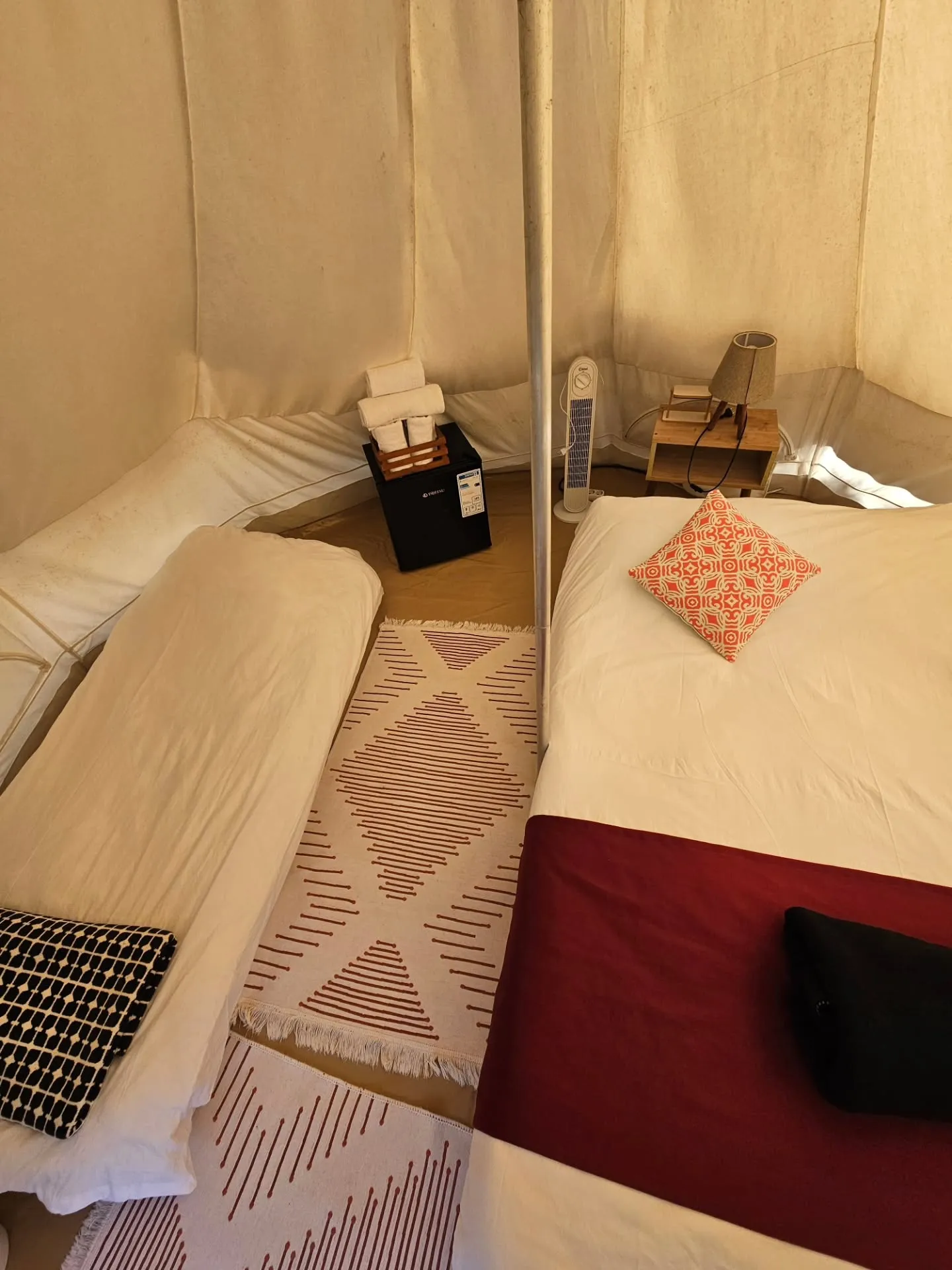 Outdoor dining beside a bell tent